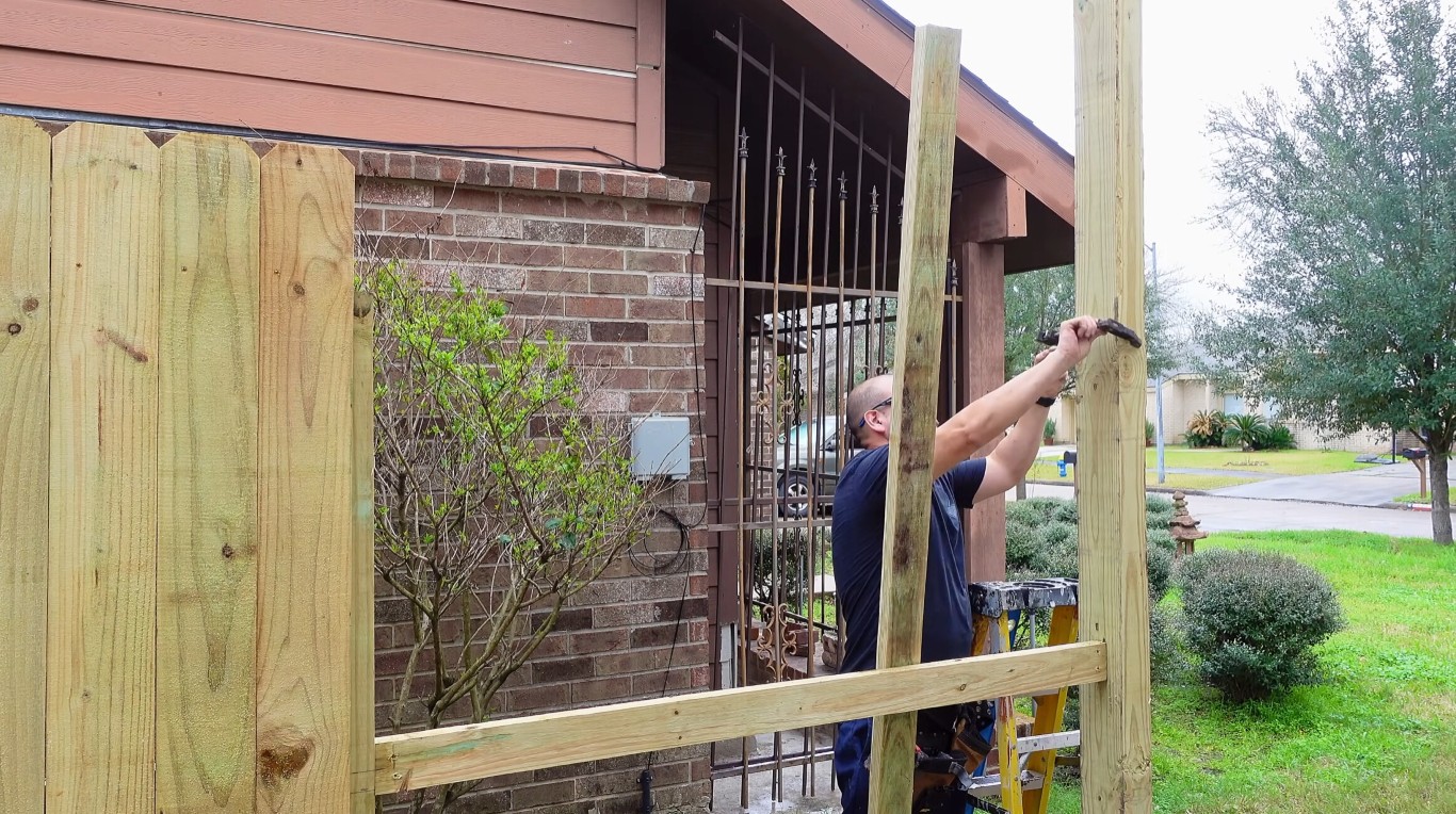 Professional fence contractor installing fence in Lancaster, TX